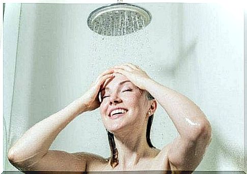 A woman is taking a shower.