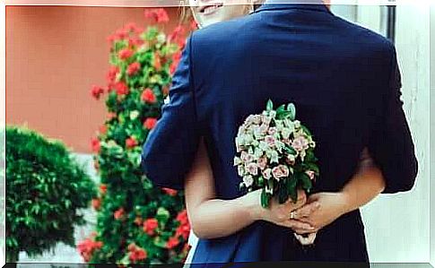 Bridal-couple-hugging-with-bouquet