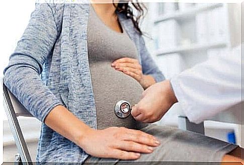 A pregnant woman is undergoing a medical exam and needs family support during pregnancy.