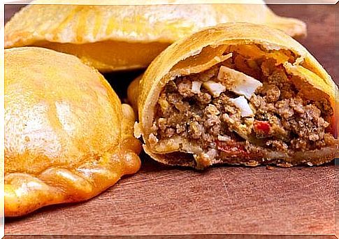 How are empanadas with meat or chicken